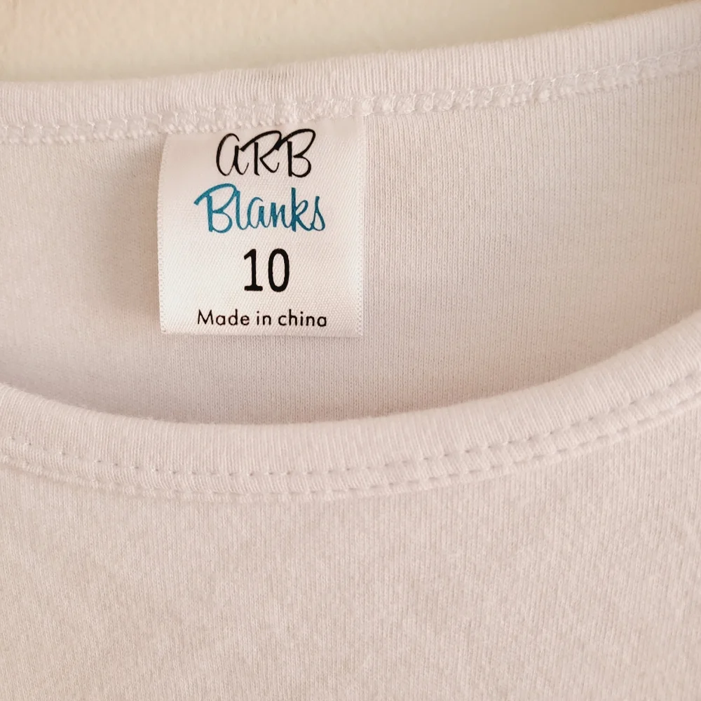 Long sleeve pumpkin tee H embroidered on front. Tags list 10 but fits 8-10